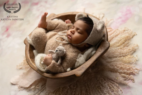 Serenity in slumber—our littlest model, cradled in warmth and dreams, epitomizes the purest form of...