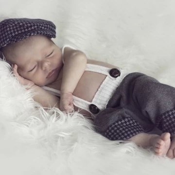 Mason was 2 weeks old in this image. It's hard to believe that this handsome little man is one now! We wanted to go for a clean classic look throughout his session. His mama did  fantastic job on his wardrobe.