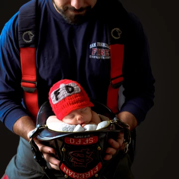 This is Mac and his Daddy who is a San Francisco firefighter. This was such a fun shoot at their home! For the safety of baby this is a composite shot. <br />
