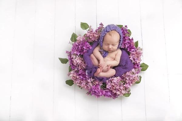I love making my clients happy! Mom wanted something different and loved purple. This wreath was perfect and probably my first baby of the year that slept through the entire session without a break! She was a dream.