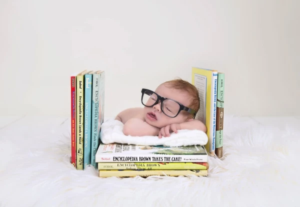 This adorable baby boy is one of my dear friends sweet boy! His grandfather wrote these books that he is laying on! Such a special image! 