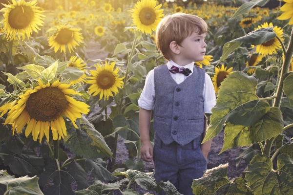 I truly love being a Mom and a Photographer so when I get to combine my two loves, it just makes my heart feel full. This is my beautiful son; Michael. He wasn't having the greatest day but seemed to really enjoy running around a sunflower field as tall as he was. This is my absolute favorite photo I've ever taken of him. I'm so pleased I was able to capture his curiosity and love of Nature in one image. 