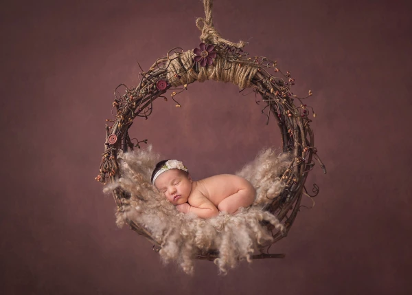 This is beautiful baby Sienna! I love the earthy tones, and how small and sweet she looks! The image is a composite image, to ensure baby safety.