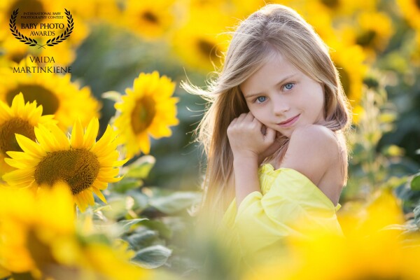 Sunflower girl. I always wanted to have a photoshoot in a sunflower field. There are not many such places in our country. <br />
And one day I got a call: "Hello, we want a photo session in the sunflower field.  And we have it - our own."<br />
I'm so happy I got the chance to get amazing pictures.  And one of them is here :)
