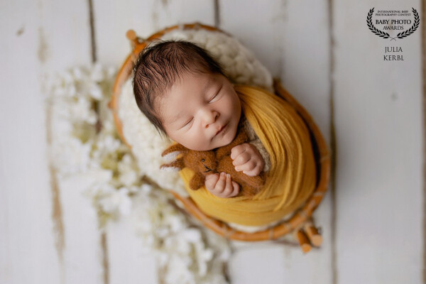 Little baby boy loves to be swaddled.