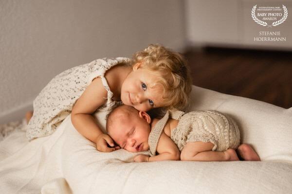 Unbreakable bond: From the very first moments, a sibling's love is pure and everlasting.