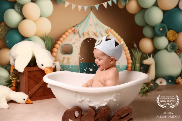 Splish, splash, and a royal laugh! A little king enjoying his bubbly kingdom — where birthdays are magical and every drop tells a story.