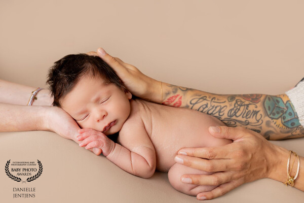 Tiny baby Scott, held tenderly in the loving hands of his two beautiful moms.