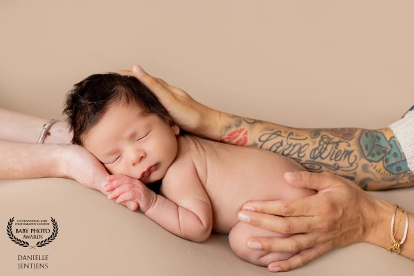 Tiny baby Scott, held tenderly in the loving hands of his two beautiful moms.