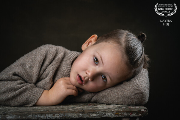 A portrait of my son. He loves to make photo's in my studio.  Its always good to have the best model...