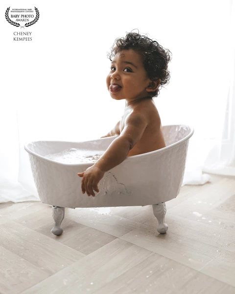 That tiny tongue-out moment? Absolute gold. The kind of spontaneous, cheeky expression that tells he...