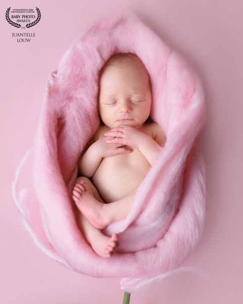 Baby wrapped in soft pink flower