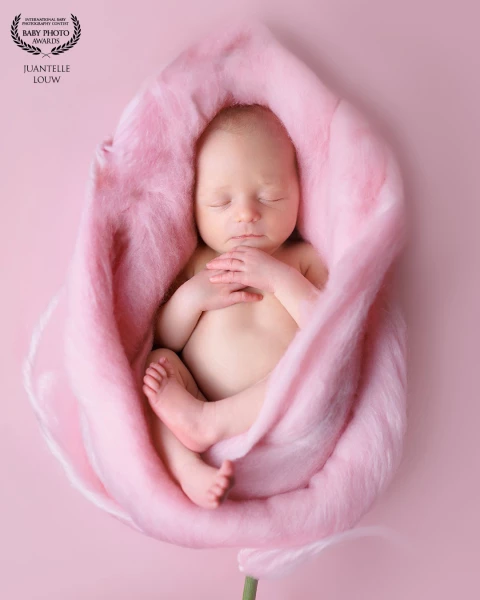 Baby wrapped in soft pink flower