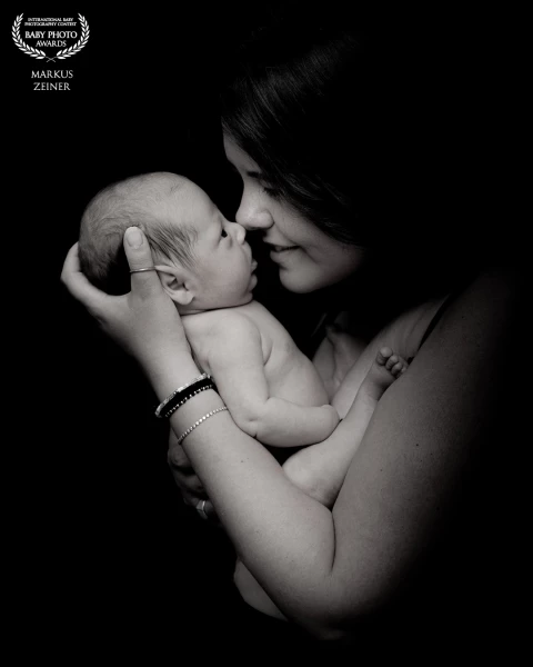 Between silence and closeness, a moment of pure connection unfolds. This intimate black-and-white po...