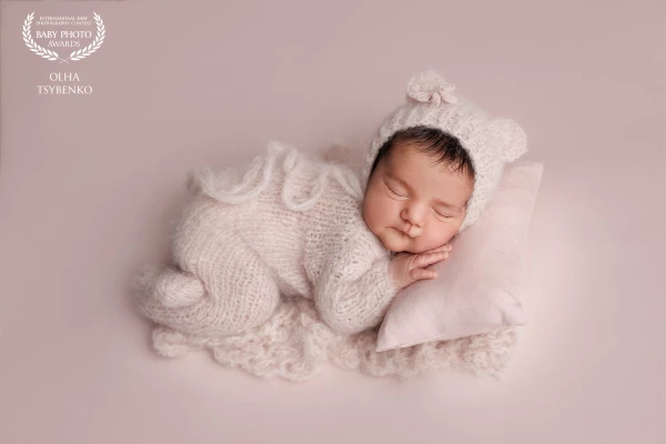 A little princess peacefully dreaming in soft pink, capturing the pure sweetness and tenderness of n...