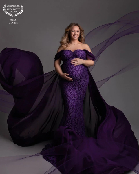 A beautiful mommy to be with a beautiful color dress, I love it.