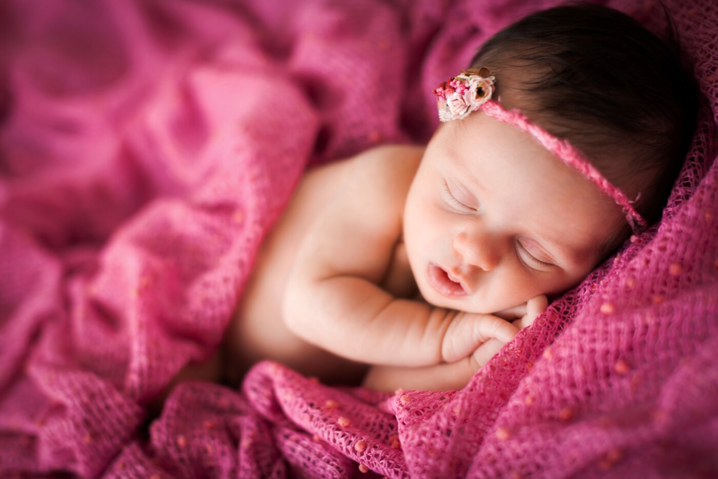 This gorgeous little girl was an absolute gem. We had baby Ariana positioned on the bean bag on a light pink coloured blanket. We decided to drape the bright pink popcorn blanket around her to look as though she was tucked up in bed all snug. One of my favourite images.