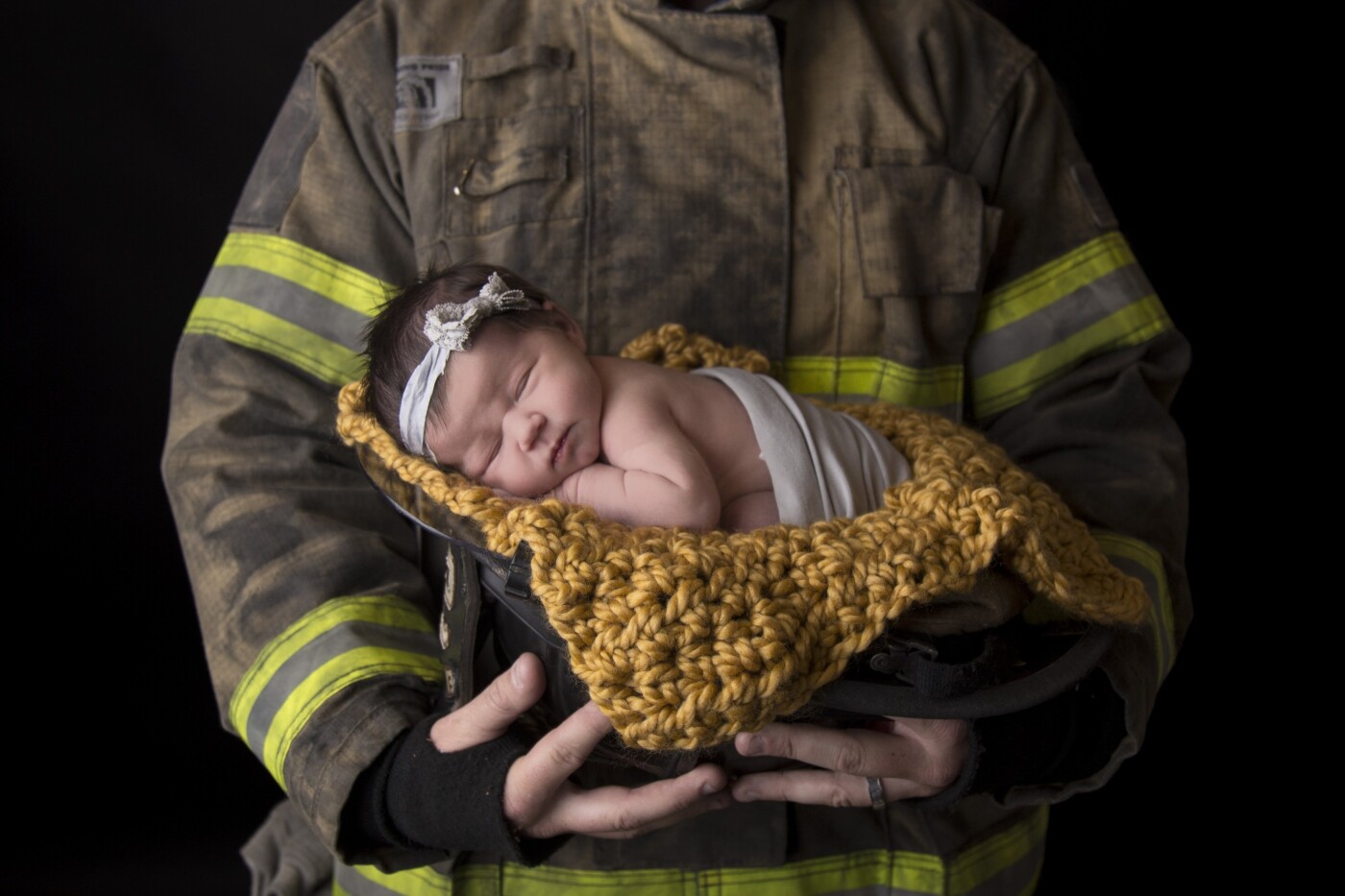 Mom and dad met while working for the same fire company. They caught each others' eye and started going out. Now, they are married and this is their second baby and first girl, daddy's little girl.