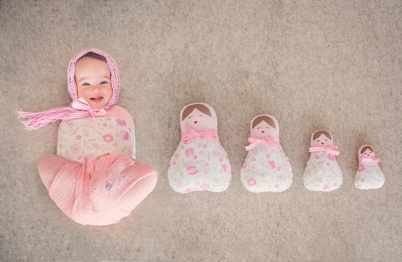 This happy little girl is Lucy. Her mother wanted a Russian doll theme so after much hunting for the perfect dolls, I asked from the doll maker for a matching piece of fabric for Lucy and this image is the beautiful result.