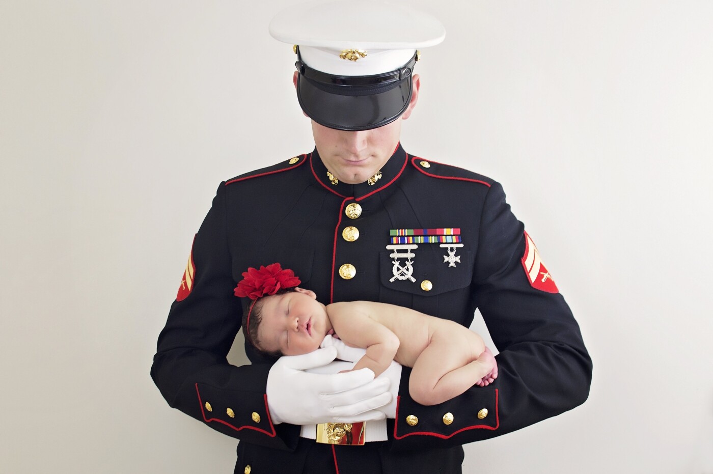 Living in a military town, there are so many Sailors and Marines with new babies. This little girl had so much love surrounding her, they even named her Valentina! This sweet girl was so happy to be in her Father's arms and fell asleep perfectly and settled right into him. I truly love this photo as it represents all the protection and love that not only a Father has for their new child but the Military does in protecting our great Country.