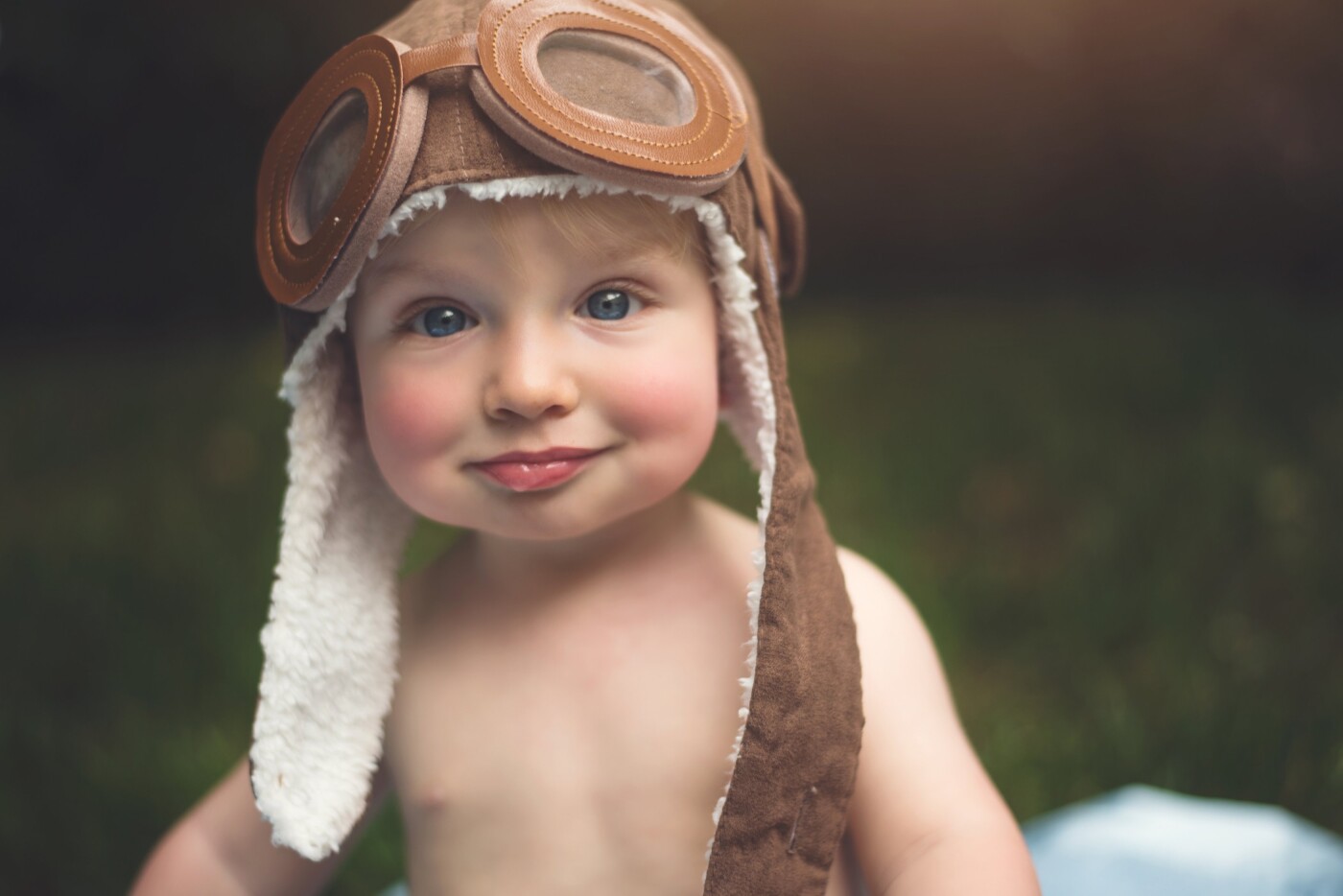 Noah is such a little sweetheart! His grandfather is a pilot, and when I was doing his milestone session, we were able to grab his little aviator hat and a little wooden plane and have some fun! It was a perfect fathers day present for his grandfather too!