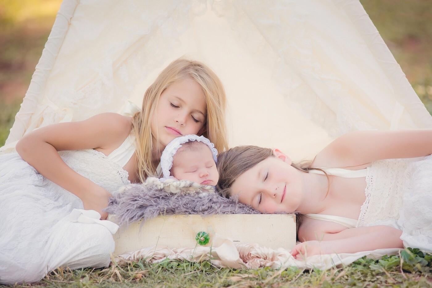 These two big sisters are so proud and protective of their new baby sister. This baby girl is very loved! We shot this session in a beautiful pecan orchard.   