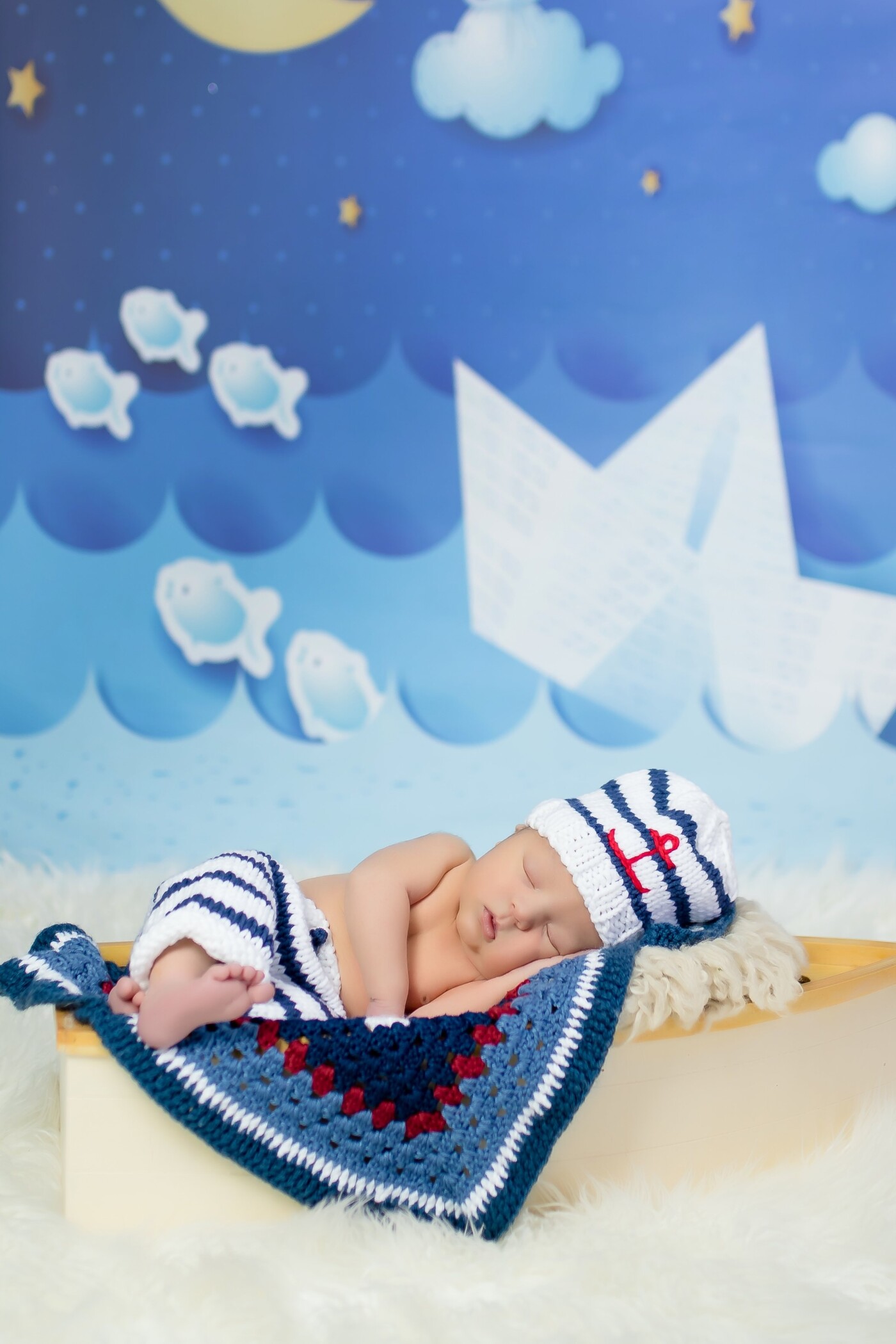 Oh this cute baby was a treat!   Momma requested nautical theme to match baby's nursery and he slept away in his little comfy dream boat.   