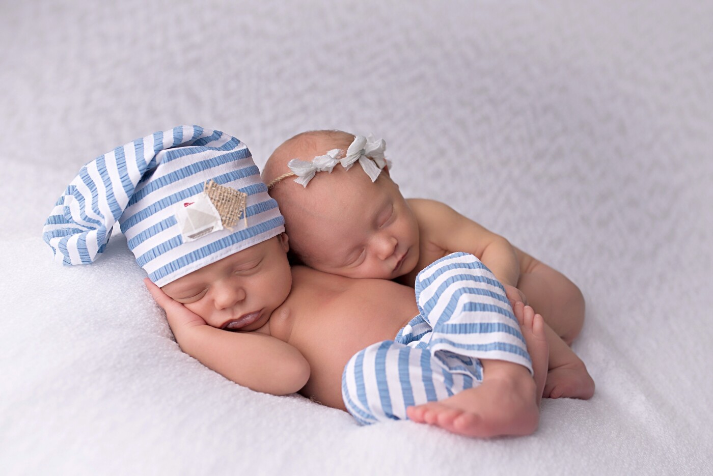 Adorable Asher and Bexley are not twins, but actually cousins born to sisters just 30 hours apart.  While we conducted individual newborn sessions for each of them, we wanted to have a few of them together for the family to document their closeness at birth. 