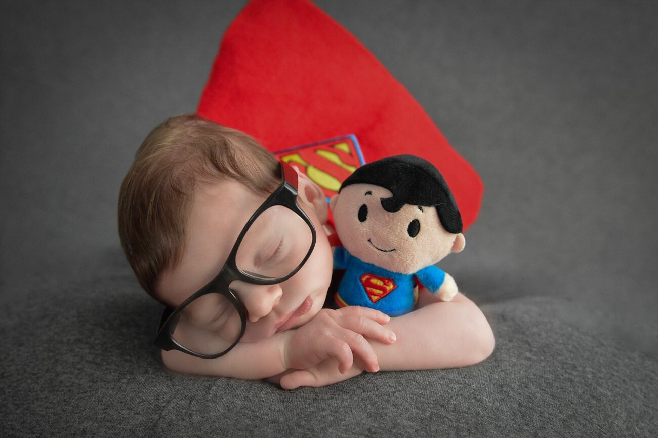 Superman flew into the studio for a little nap! This little dude is a superman fan just like his daddy. I think he makes the cutest little superhero! 