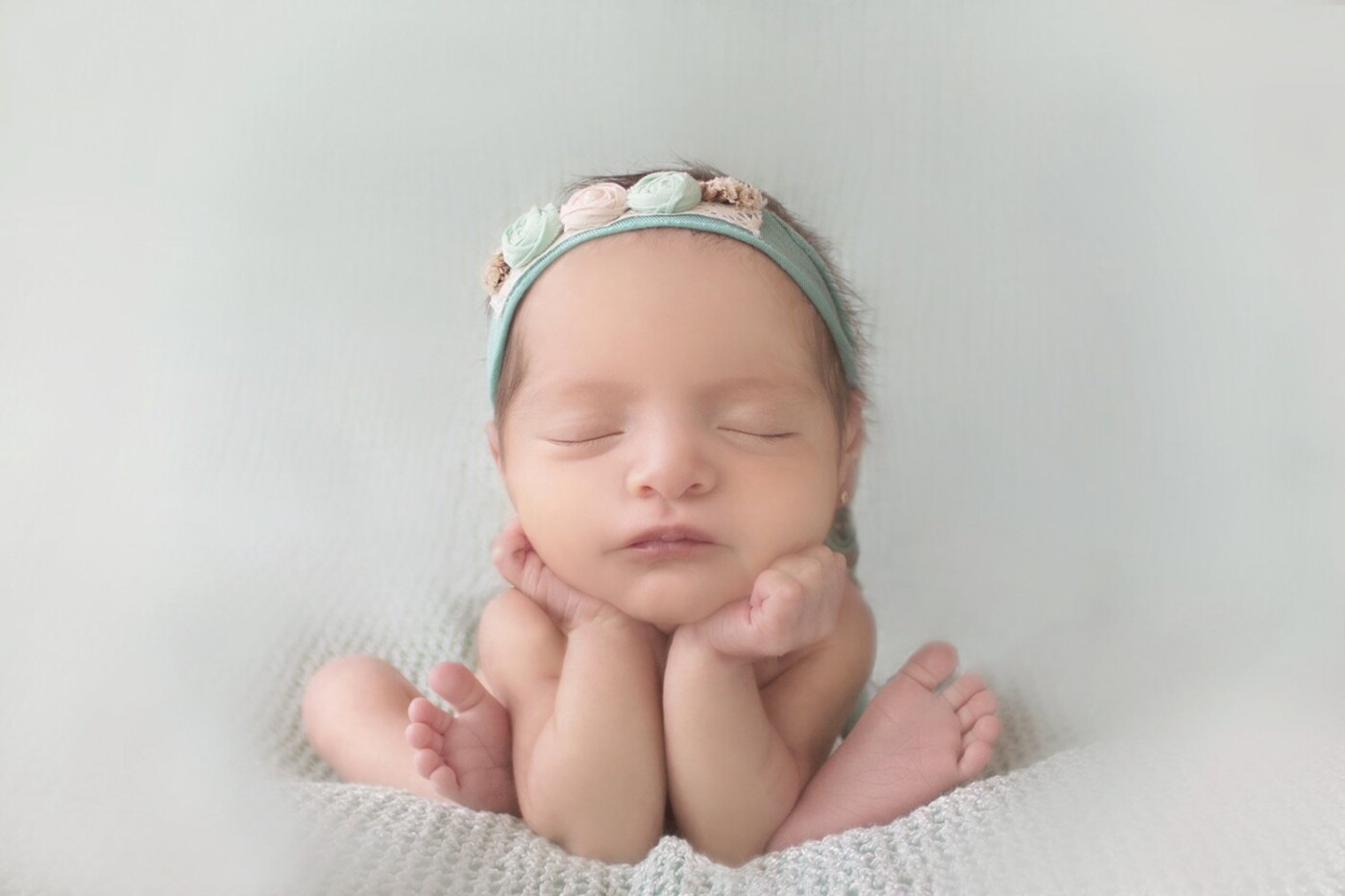 Sweet little Emma was 13 days new when she came to my studio for her newborn photoshoot. Mom and dad asked me to try a froggy pose with her. Luckily, she was very sleepy and dad helped all the time to get this beautiful image. I'm very happy with the final result. 