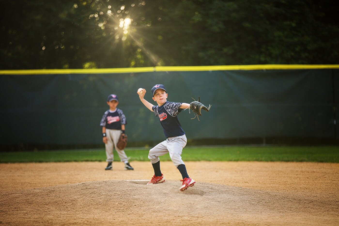 This is was my son's first year playing travel baseball and I loved every minute of watching him and his teammates play their hearts out.  This is a photo of one of his teammates warming up to pitch!