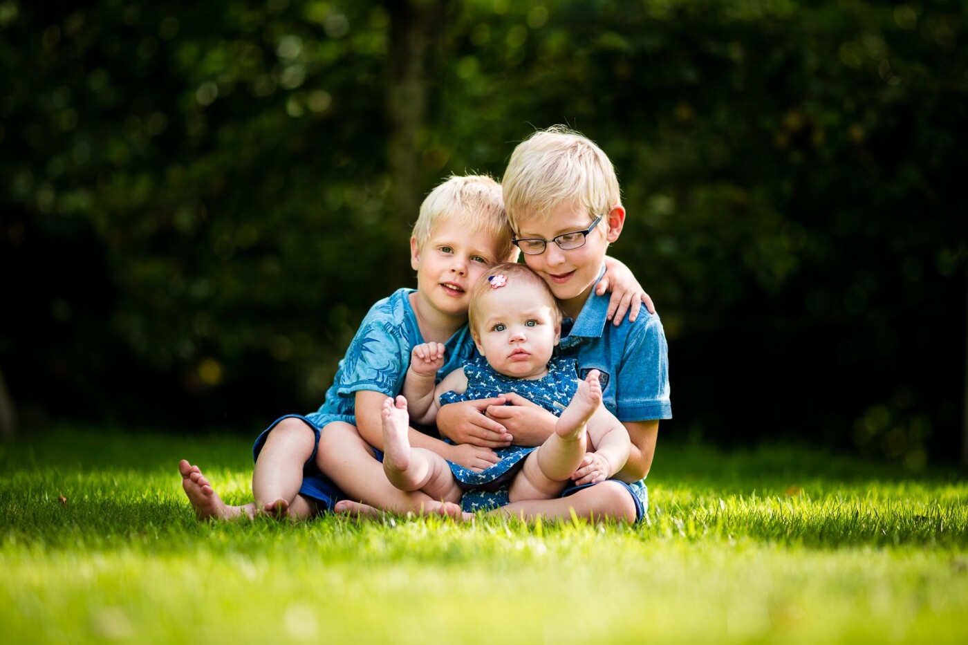 Two sweet brothers hugging and loving their niece as if she was their own sister.