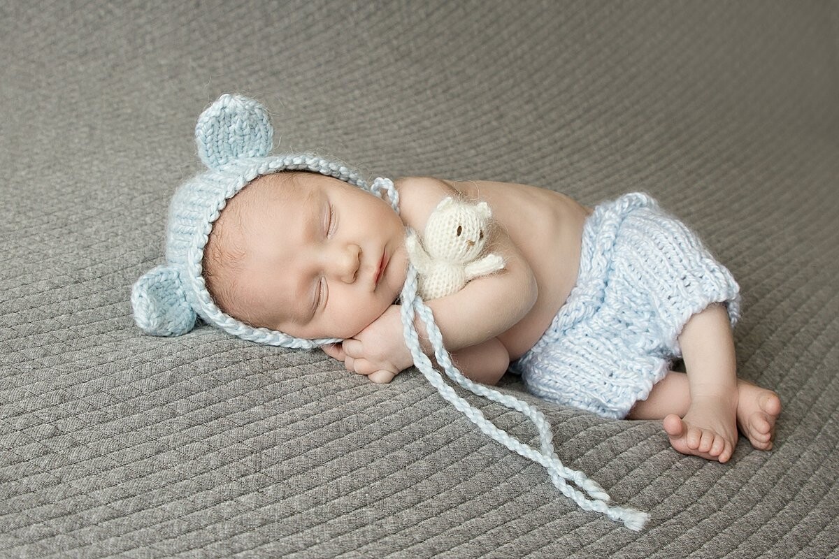 Sweet newborn baby T cuddling his little bear.  He arrived 2 weeks early, and at his newborn mini session he was photographed at 8 days new!