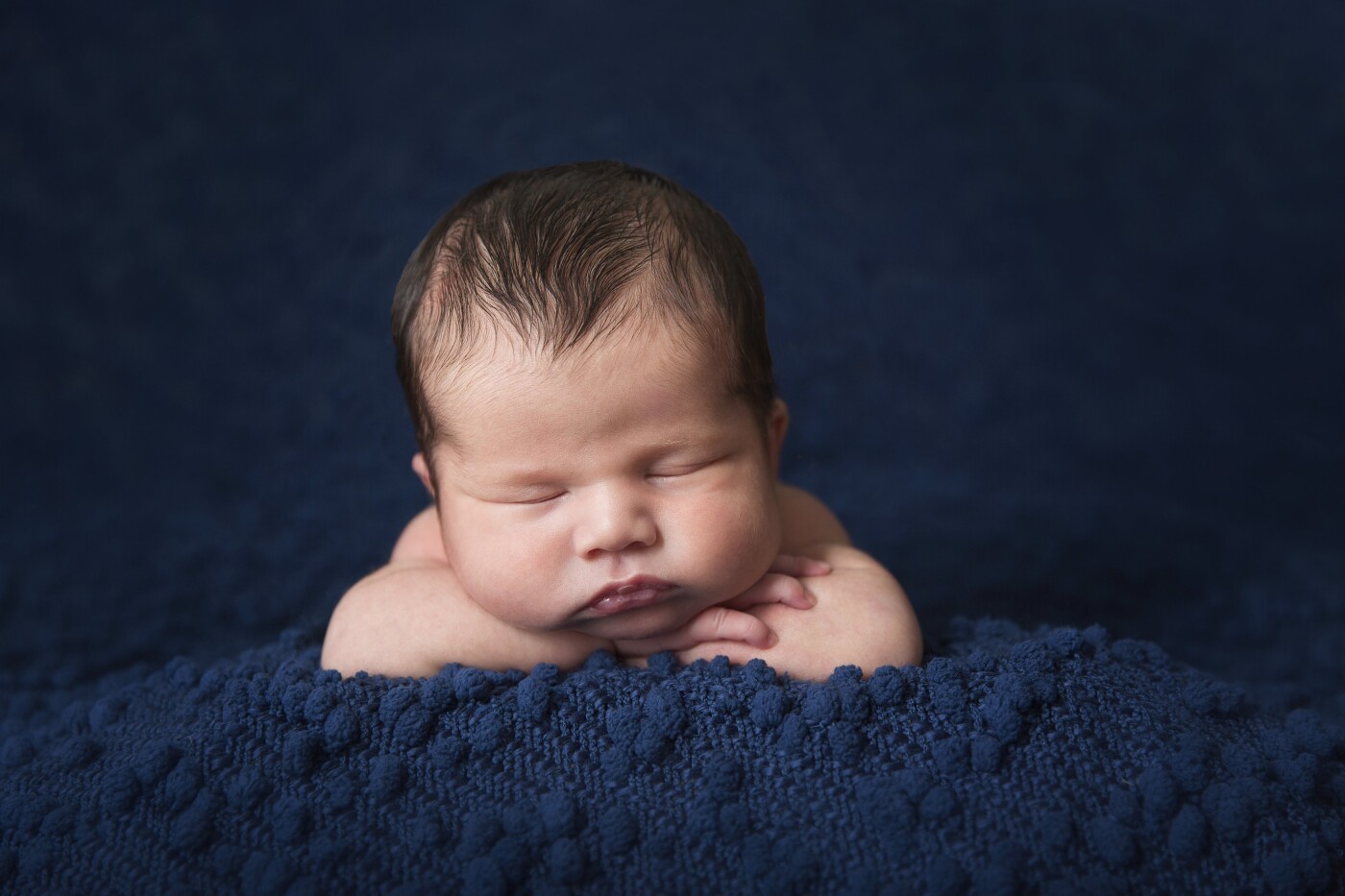 Baby Julian at 10 days old slept through the entire session. I love how the dark blue blanket surrounds his tiny little face. Don't you just want to squeeze those cheeks? 