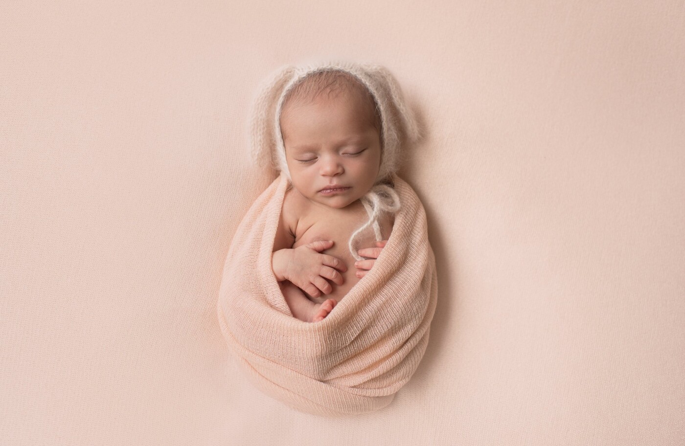 This little sweetheart was somewhat alert for her portrait session, but she loved being wrapped up.  Her parents loved my angora bunny bonnet, and we all thought that she looked just perfect as a snuggly little bunny!