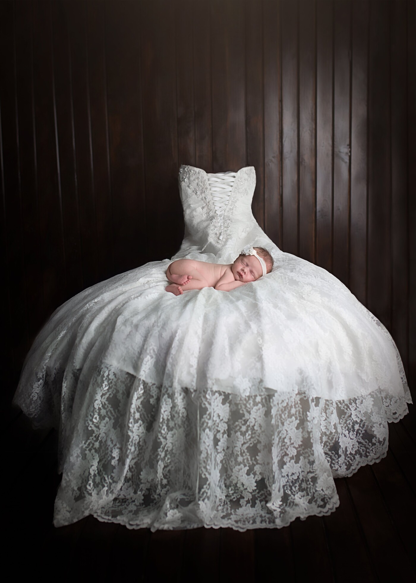 This little sweetheart's mother wanted to incorporate her wedding gown into an image for her newborn session.  As she may never actually wear the gown in the future, this image is a precious memory for her parents.