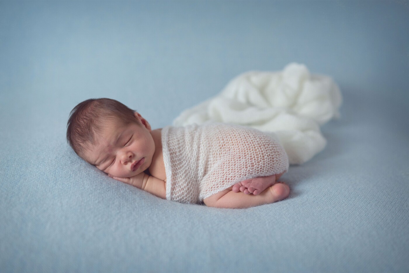 This little guy has the cutest cleft in his chin, that I didn't notice till I was editing. I love newborn sessions and all the excitement and nervousness of new parents. I love to snuggle these cuties and give their parents memories for a lifetime.