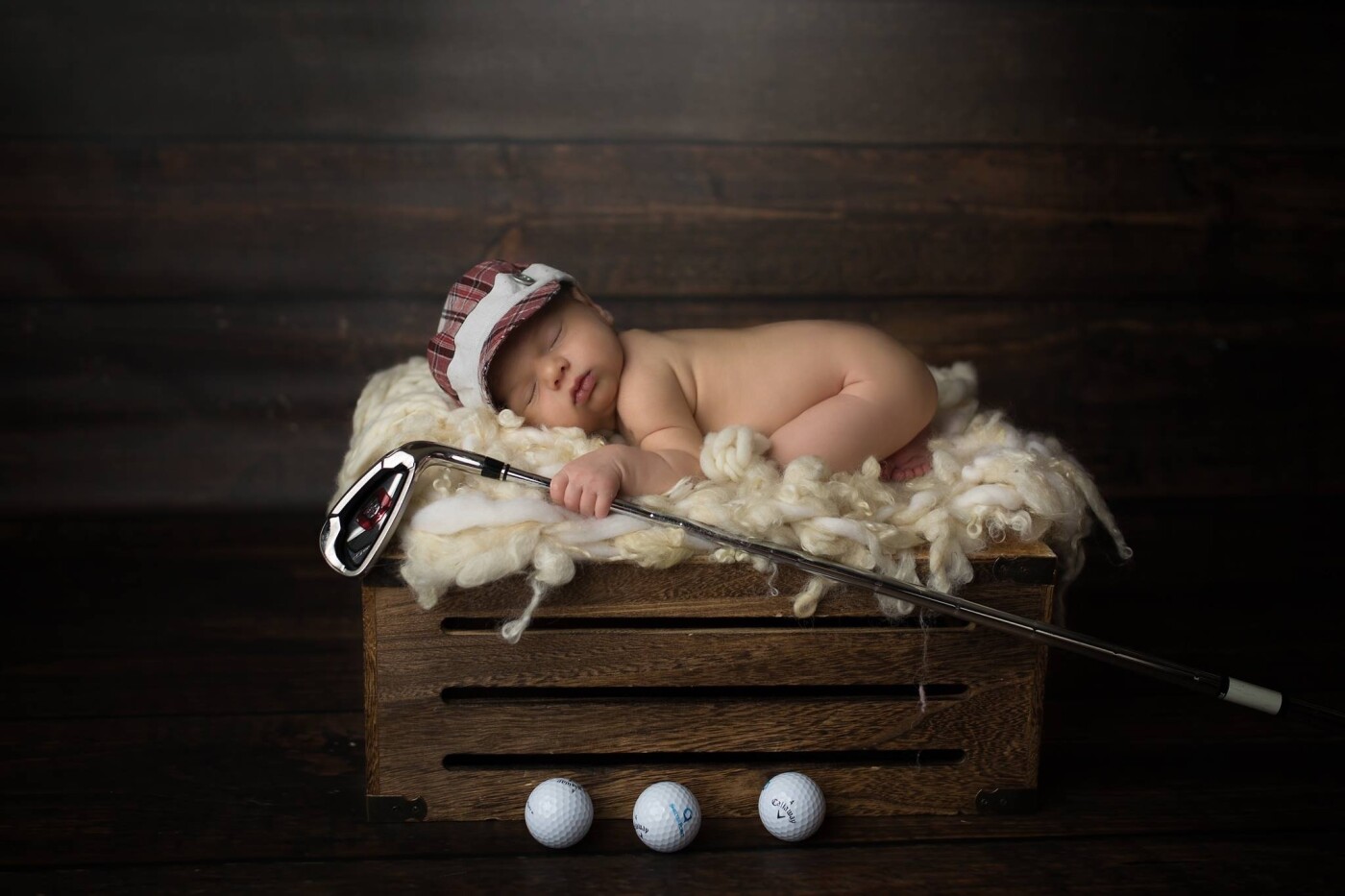 This little guy's dad is a golfer so mom requested to incorporate golf into his session.  At a few days new he already looks like a pro :)