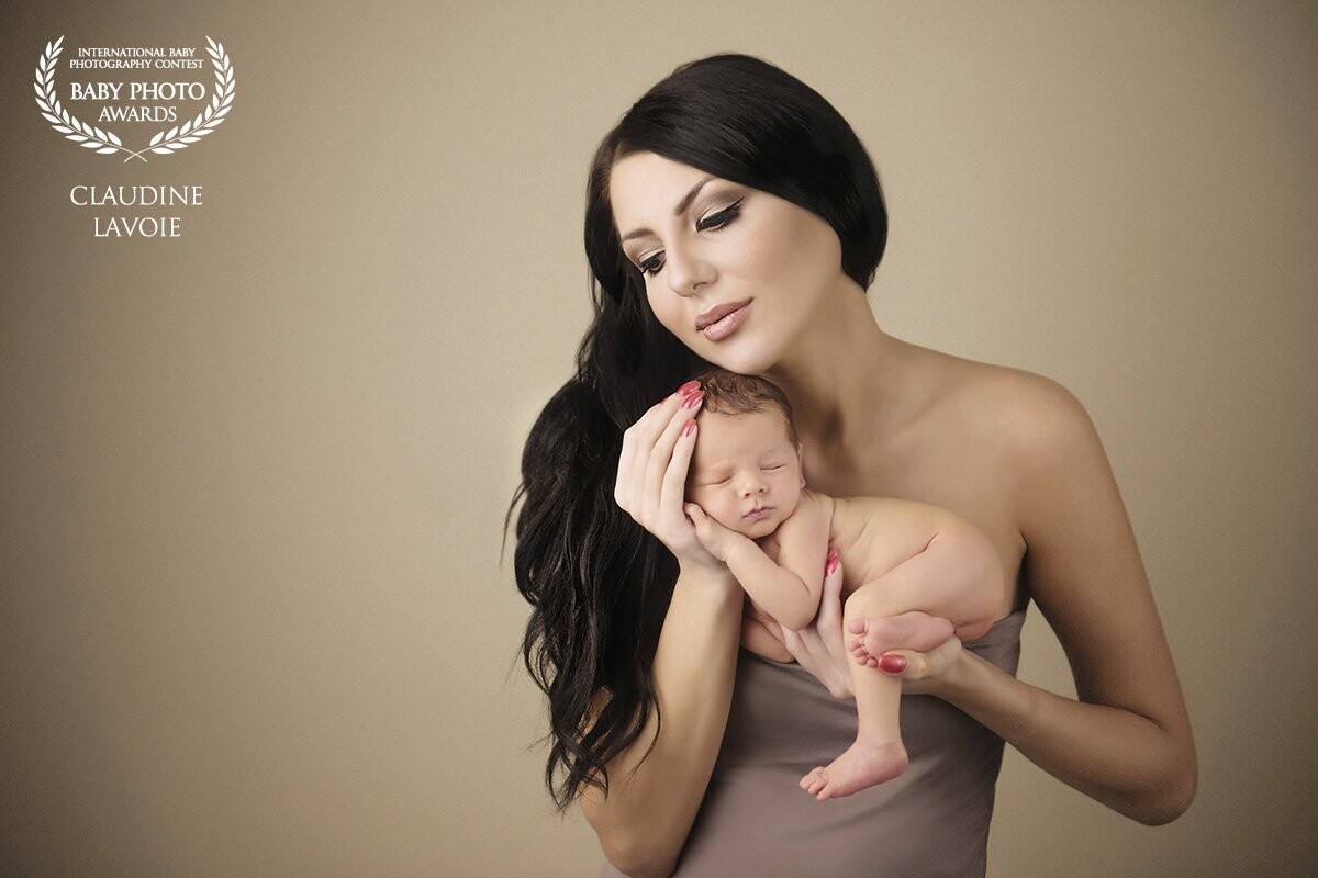 This image is of Victoria and her beautiful son Victor when he was one week new.  I had worked with Victoria on a commercial shoot and I had the pleasure of seeing her again one year later in a completely different light.   She held her new son like he was her entire world.  I loved every minute of this session, and am thrilled this image was chosen as my first award.