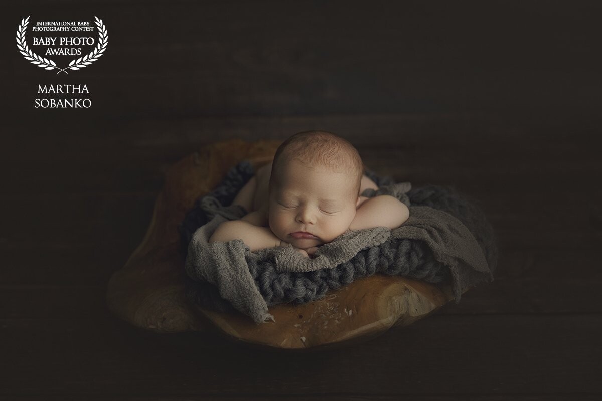 This edit is a little different from my usual but I love how the baby pops and the rest of the photo is darker.  As per mom's request of photographing baby on wooden background!