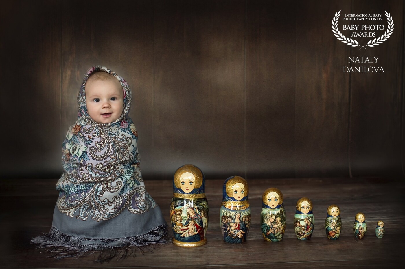 I was born in Russia and I love all about my native country. So I decided to introduce traditional Russian Matreshka doll to my friends and clients. My son helped me as a model. He is 6 moths old on this pictures. 