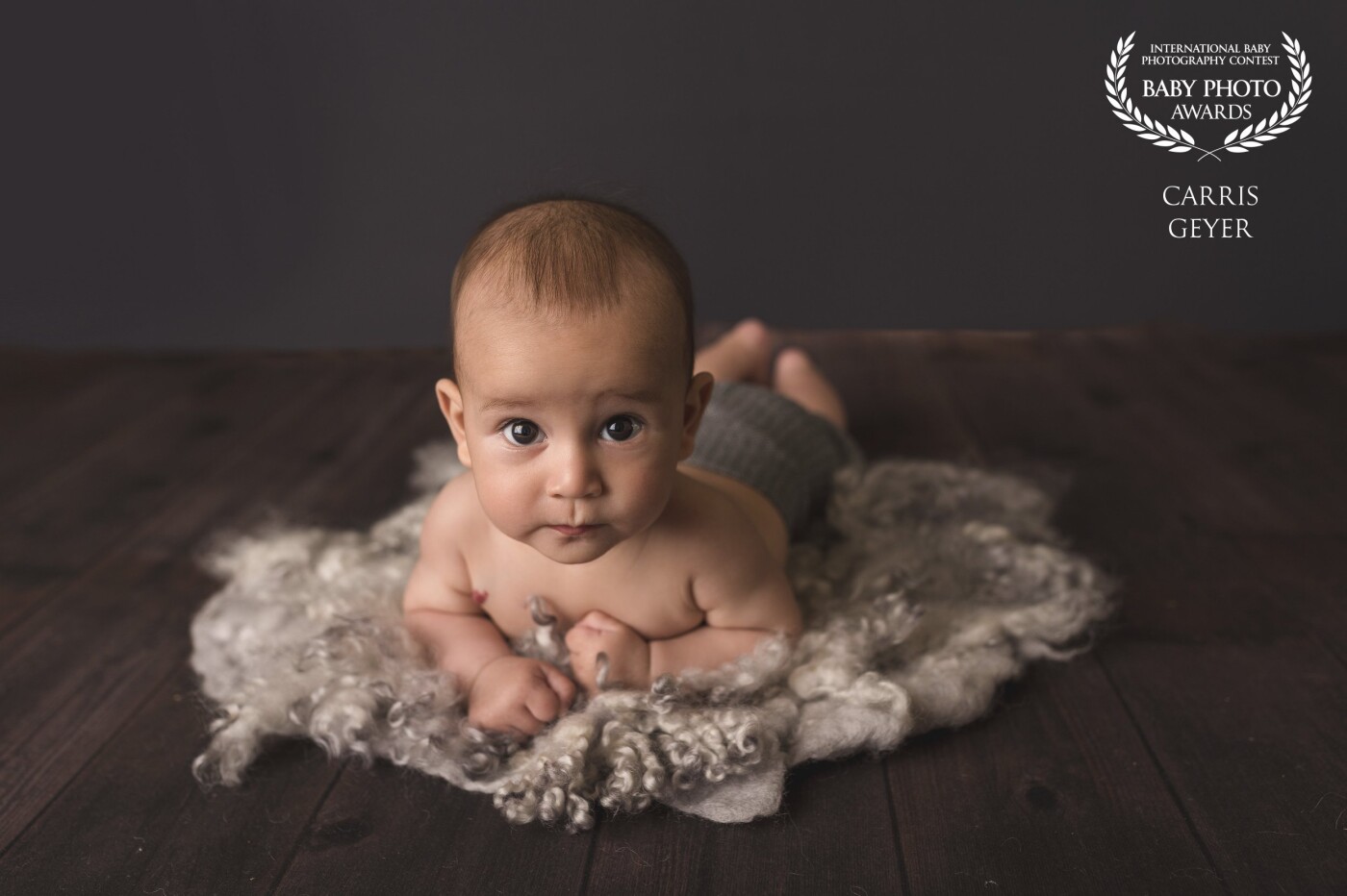 I photographed this absolutely adorable little boy for one of his milestone sessions. This was his second session at just 4 months old and he absolutely loved staring at me and my camera, we got plenty of smiles this day but his gorgeous peaceful face was too cute to pass up and this ended up being one of mine and his mum's favorite photos of the day.
