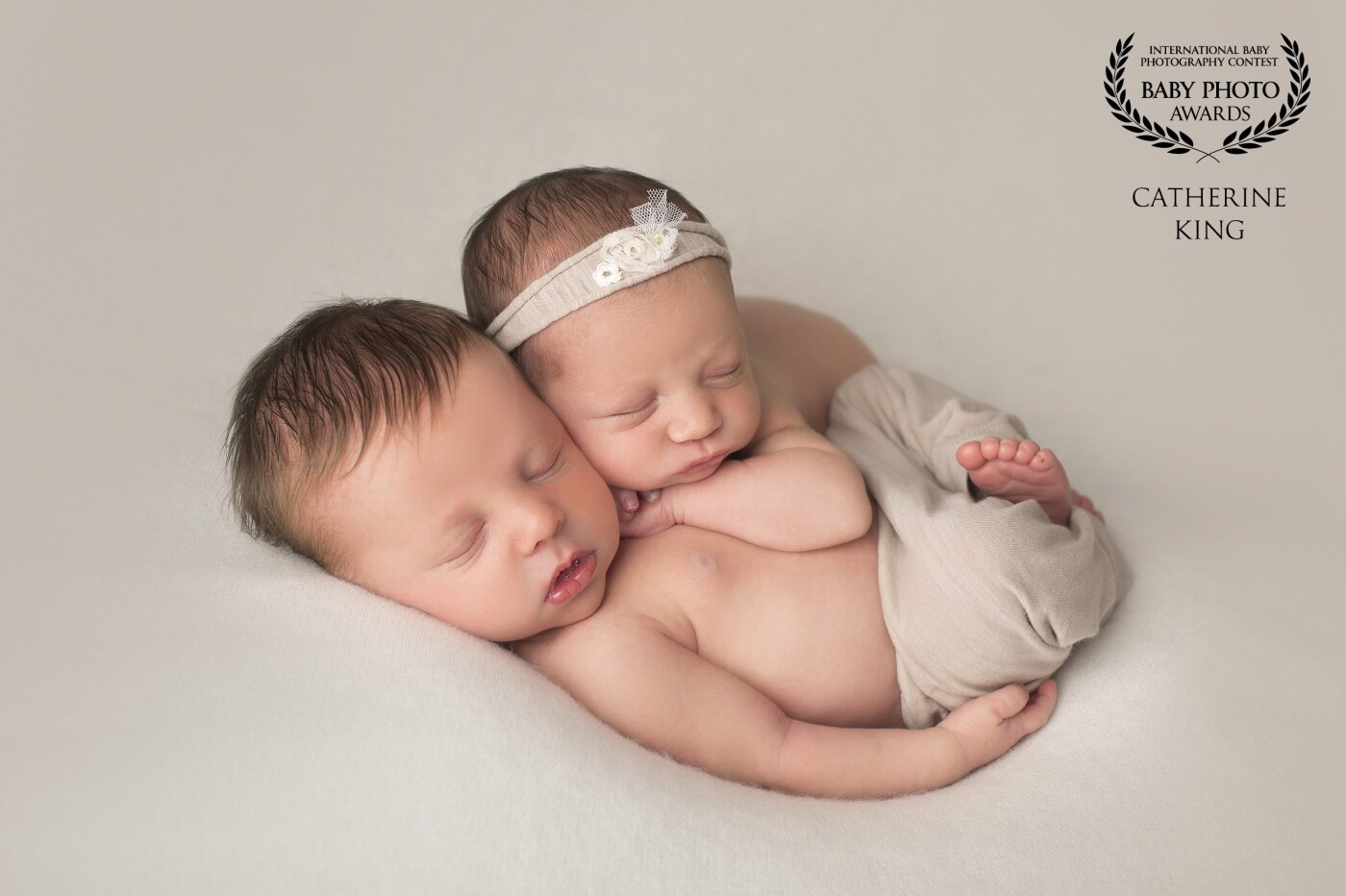 These beautiful twins were the best to work with!  The most amazing thing that I love about working with twins is that they seem to always settle once they're placed close to one another.  Even when the first baby is a bit fussy, once I placed the second baby on top they both fell happily asleep.  Such an incredible bond.<br />
