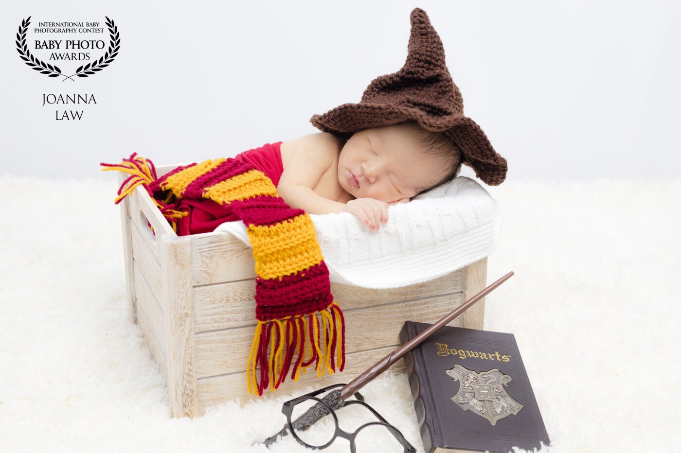 Babies are magical.  Especially when their parents already expect him to attend Hogwarts!!!!  Mom and Dad are huge Harry Potter fans, so when they learned that we had HP props in our studio, they booked a session with us in a heart beat! 