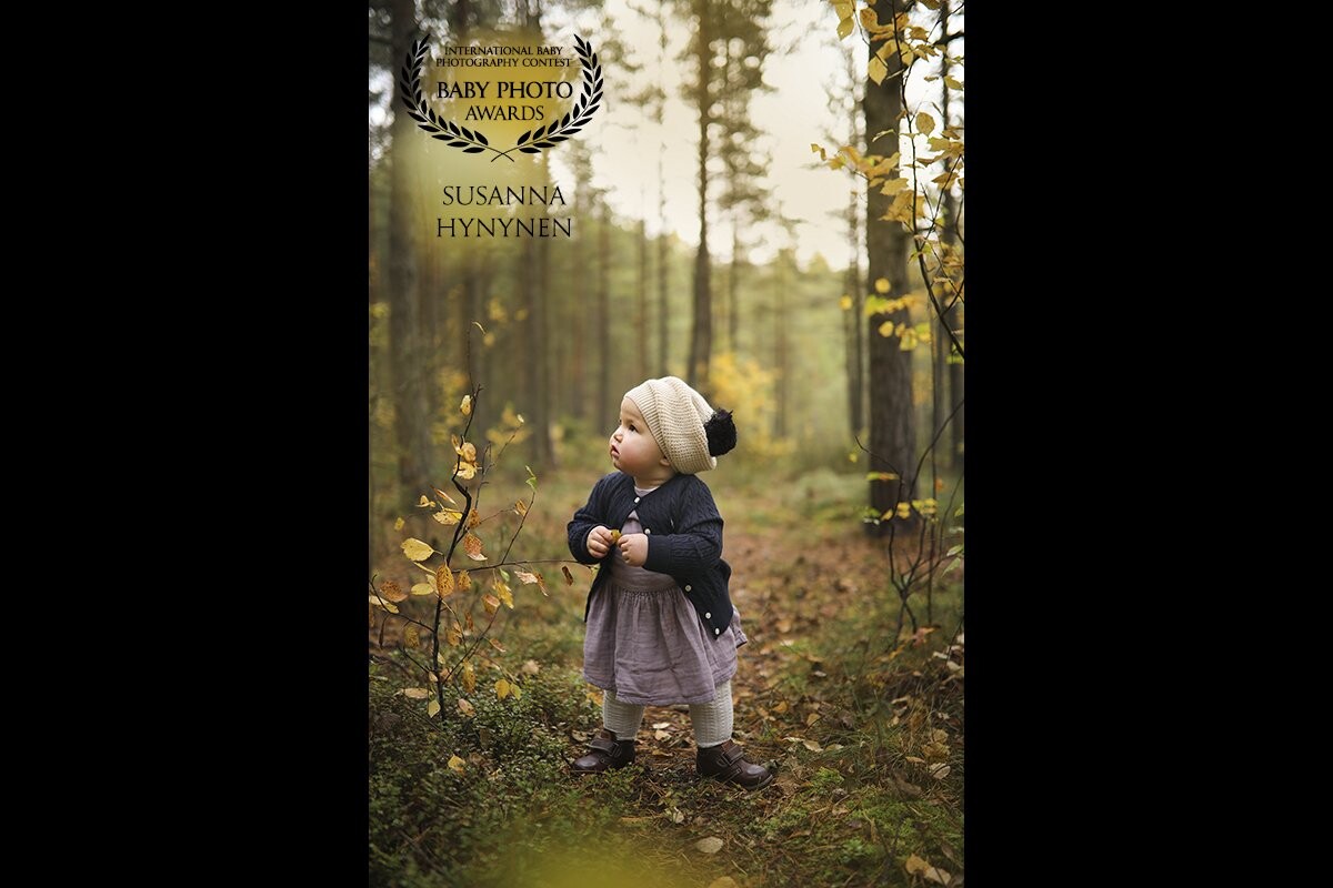 This image was shot in the forest, in southern Helsinki on a golden autumn day. <br />
In honor of this little cutie one-year anniversary, I took her 1-yearold portraits. <br />
<br />
I wanted the season to be visible in pictures, so we were outdoors.