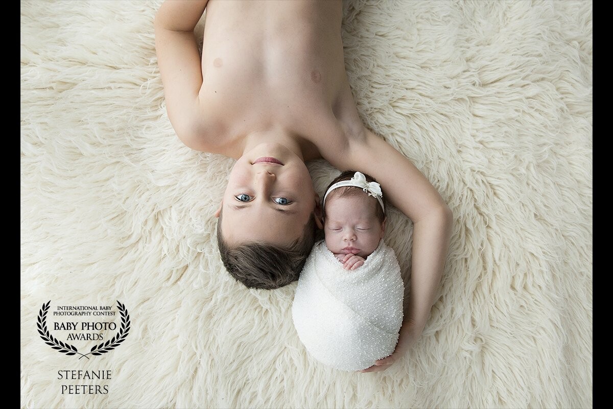 This sweet little girl was born at 30 weeks pregnancy... But, she did it so great!! She was about 9 weeks old  when she was coming to the studio for her newborn session. She rocks it like a real rockstar! She is such a lucky girl with her lovely big brother close to her side... I love this picture!