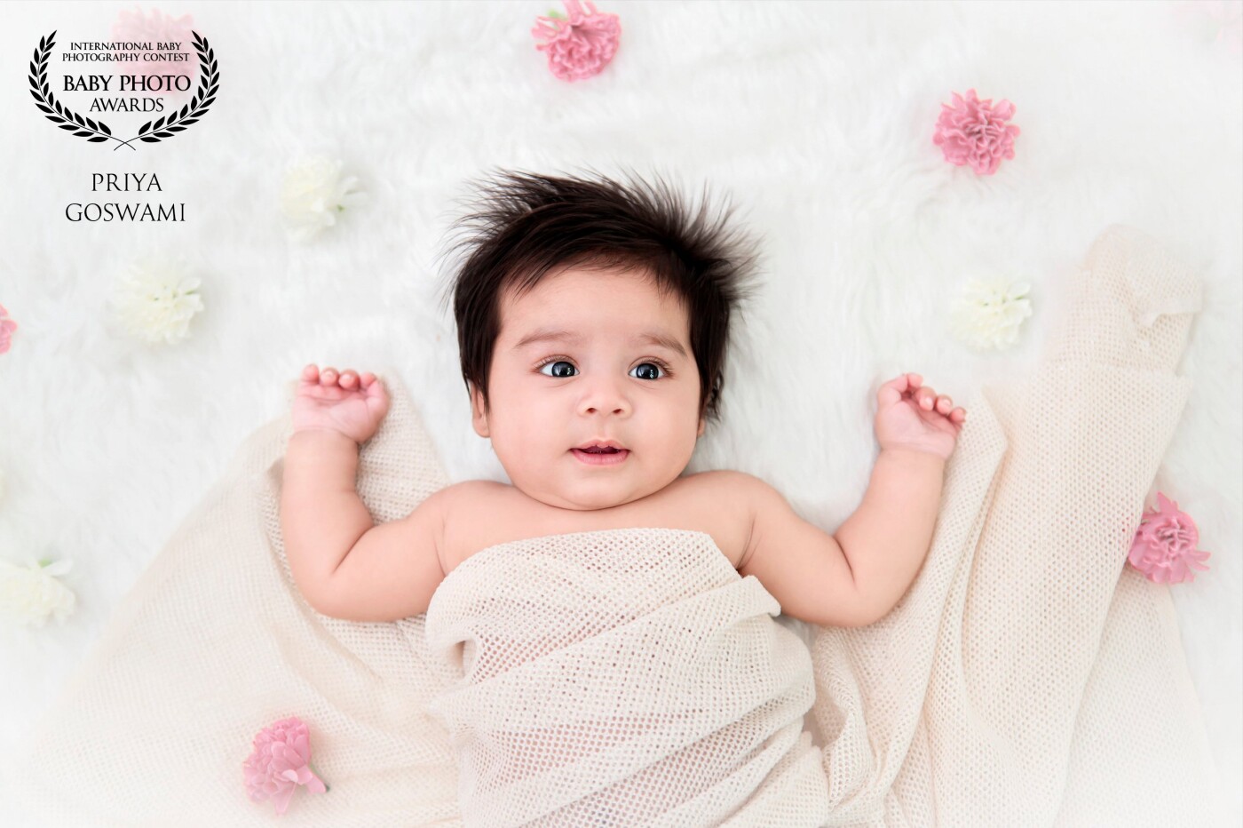 This is Baby Jazlyn at 3 months, the second child of the Basu family whose first daughter Evlyn was as beautiful when clicked. I simply adore the cute mischief in her eyes and the slight smile on her face in this capture.  <br />
<br />
Love to document these precious moments for life.
