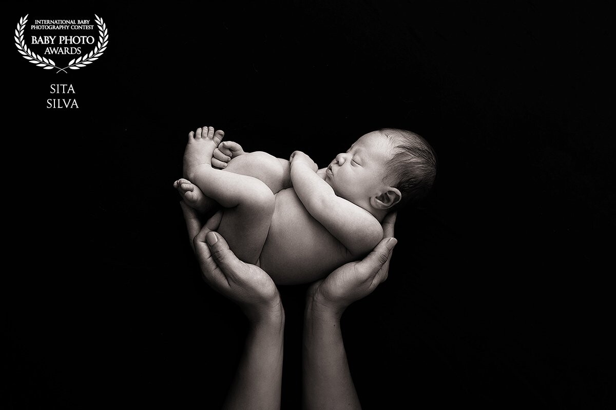 This is little Leo; he was 8 days-old when this photo was taken. This image was shot on location in the family's home using a speed light and a parabolic umbrella. It's one of my favorite images from the session.<br />
I also had the pleasure of photographing this little one's mother when he was still in her belly. It was an honor to meet this family and document this special time in their lives.