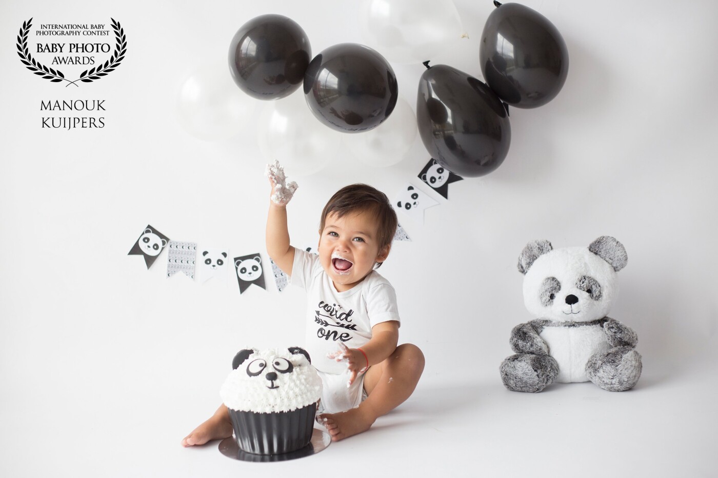 This little man was so happy during his whole photoshoot. He had no problem at all getting dirty from the whipped cream! I really love the panda theme for his cakesmash!