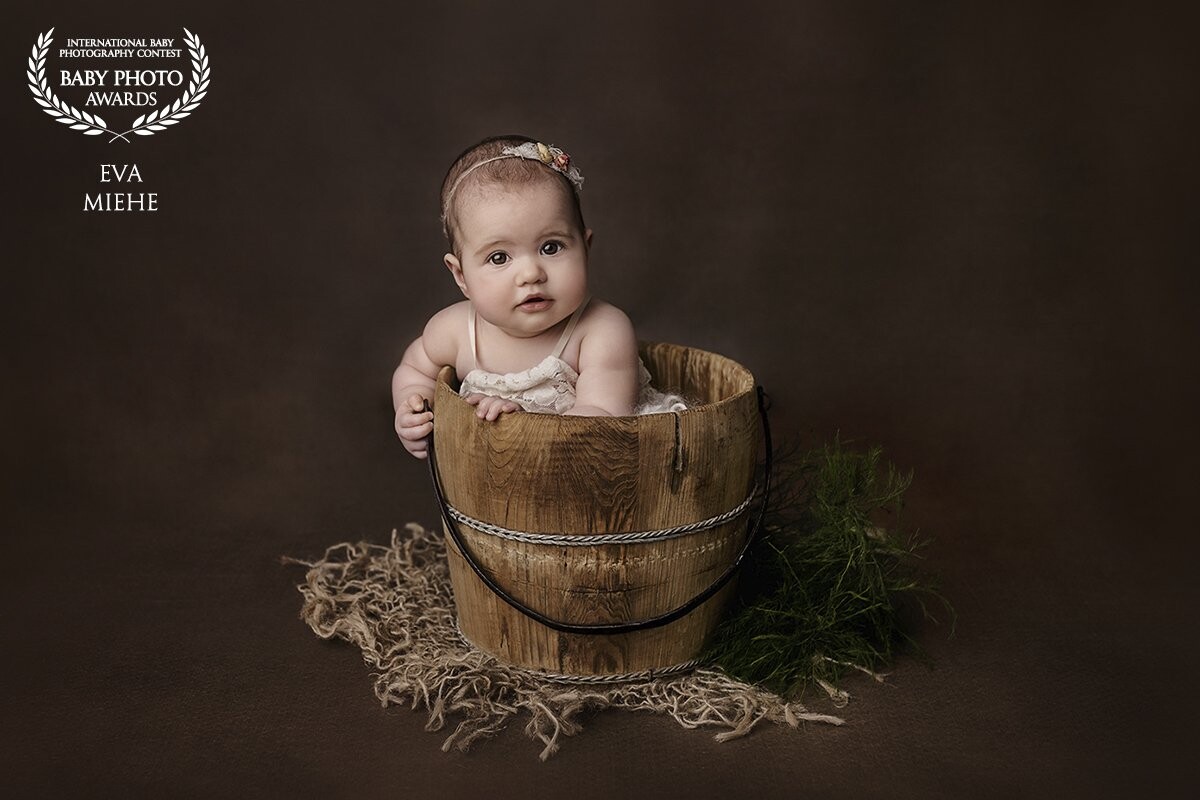 Just 5 month old and such a perfect little cutie! This beautiful girl had a lot of fun at her shooting and she loved sitting in this bucket, although she couldn't sit by herself. And look at those big teddybear eyes!